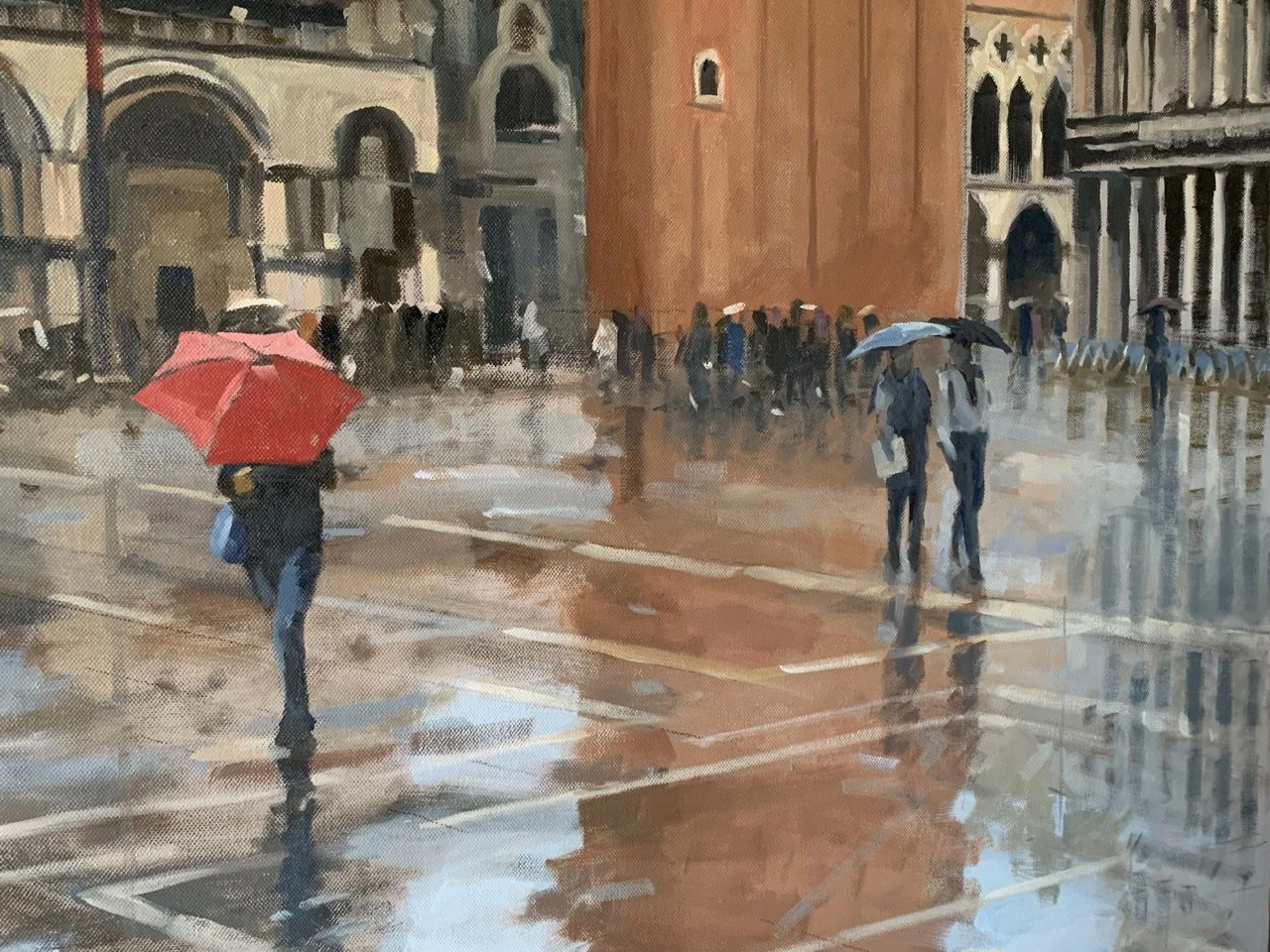 Basilica of San Marco and the piazza, rain and a red umbrella